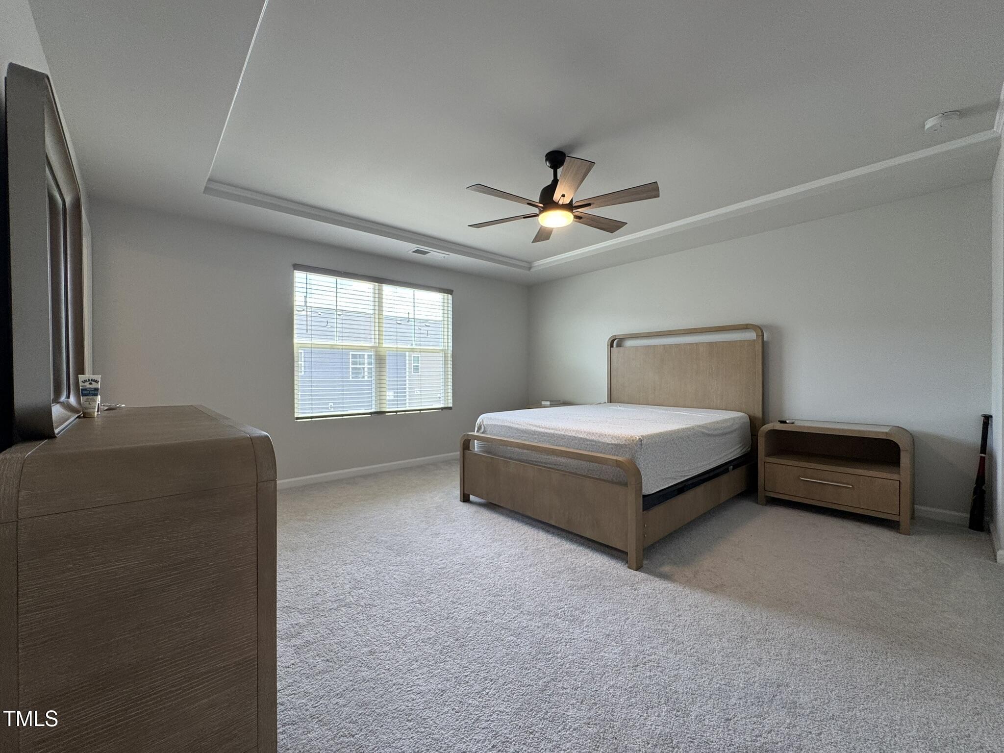 1106 Crossvine Trail Durham, NC 27703 - Photo 25 of 35 a bedroom with a bed and a ceiling fan