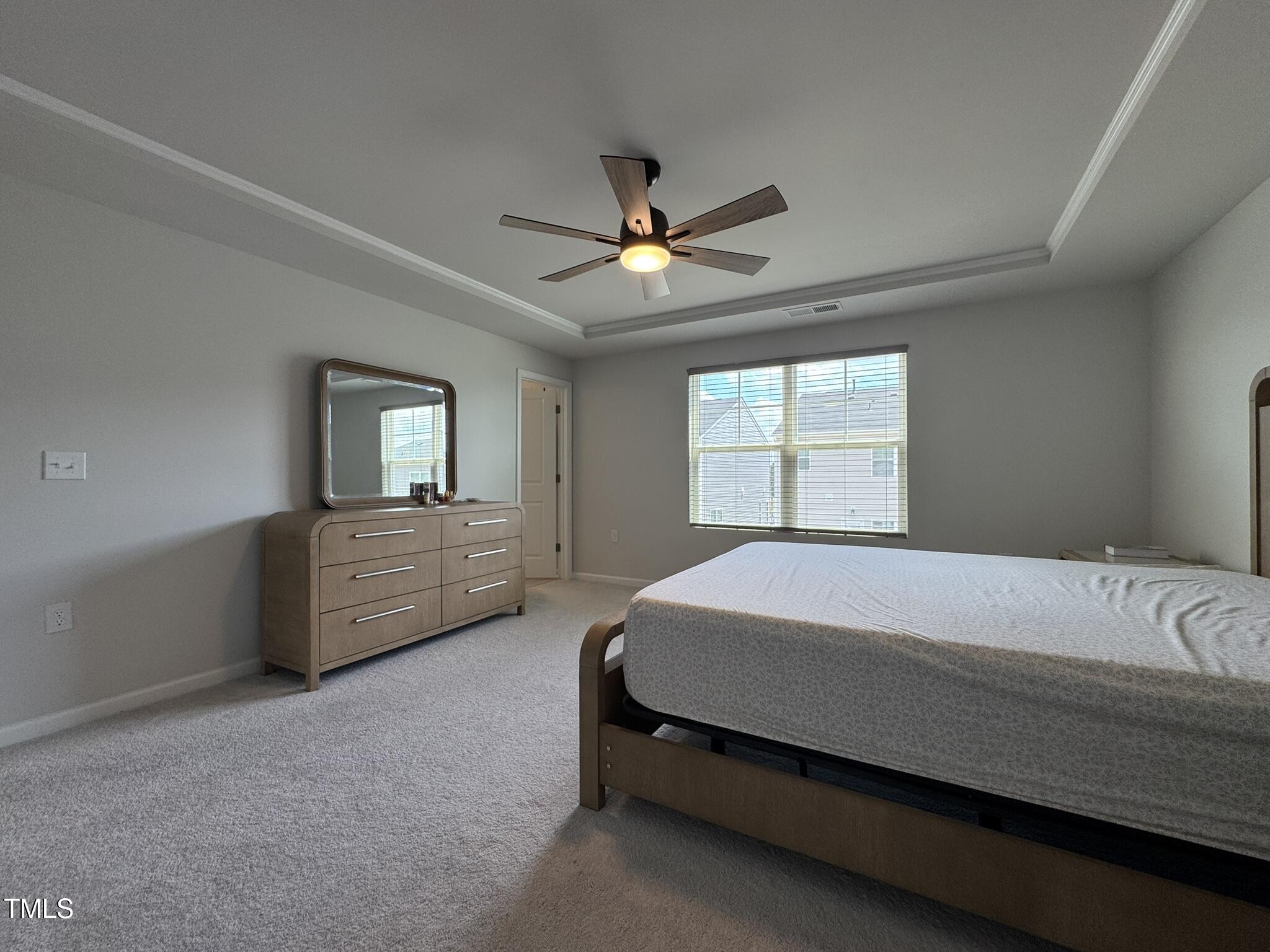 1106 Crossvine Trail Durham, NC 27703 - Photo 26 of 35 a bedroom with a bed dresser and a window
