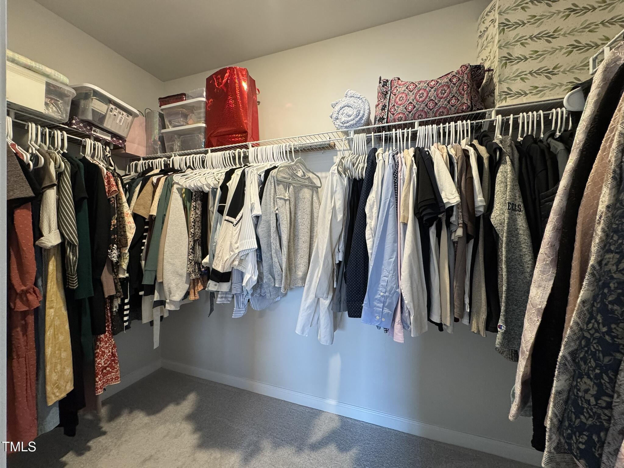 1106 Crossvine Trail Durham, NC 27703 - Photo 29 of 35 a view of walk in closet with clothes