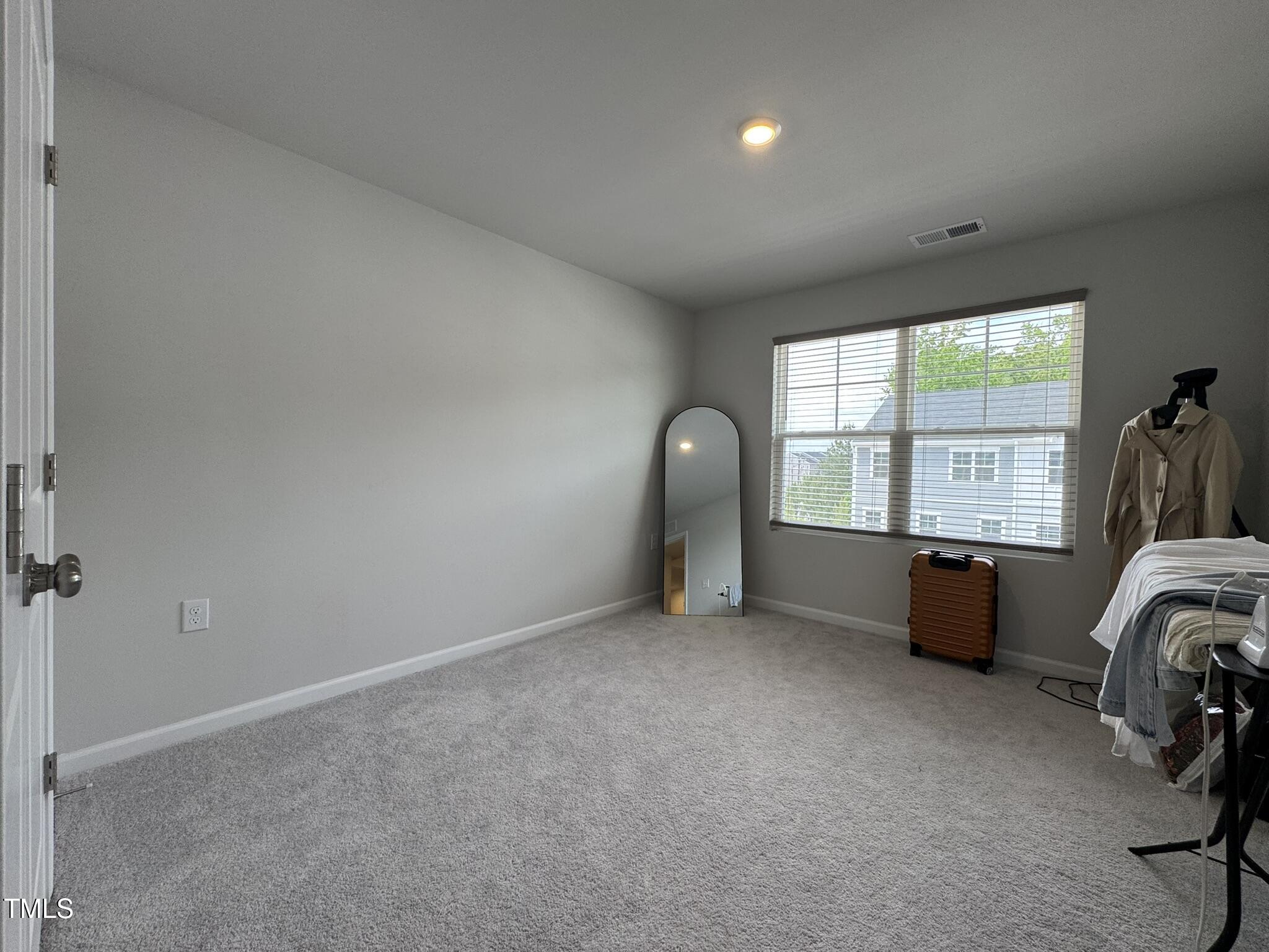 1106 Crossvine Trail Durham, NC 27703 - Photo 33 of 35 an empty room with windows and closet