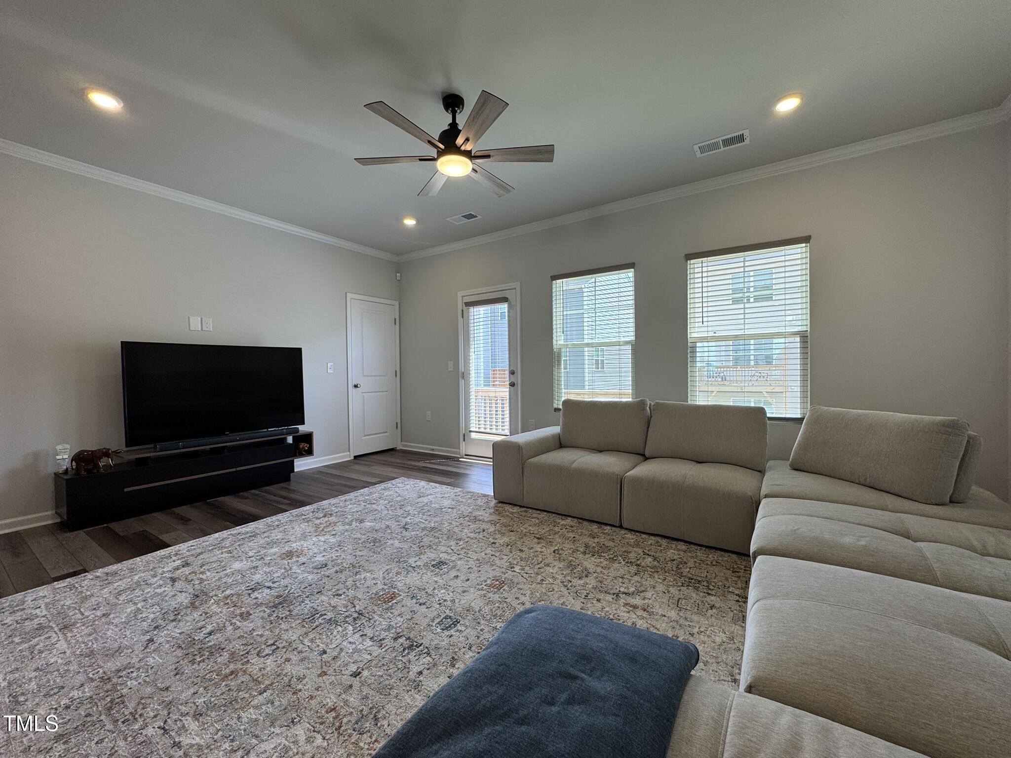 1106 Crossvine Trail Durham, NC 27703 - Photo 6 of 35 a living room with furniture and a flat screen tv