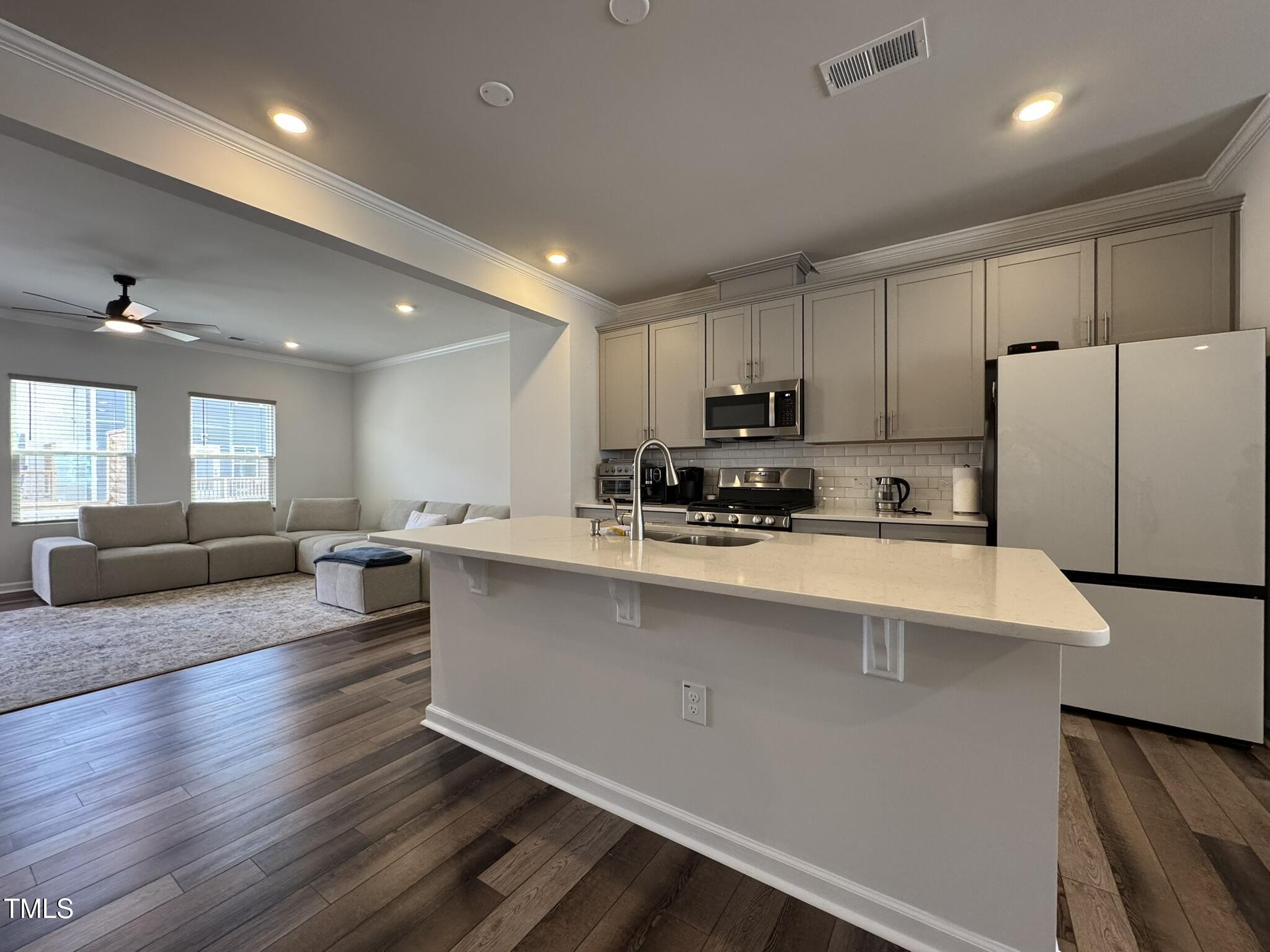 1106 Crossvine Trail Durham, NC 27703 - Photo 7 of 35 a large kitchen with stainless steel appliances lots of counter space and a refrigerator