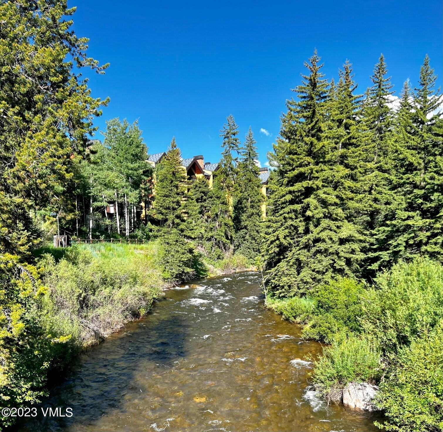 434 South Frontage Road East, Unit 202 Vail, CO 81657 - Photo 4 of 25 Creek to Building