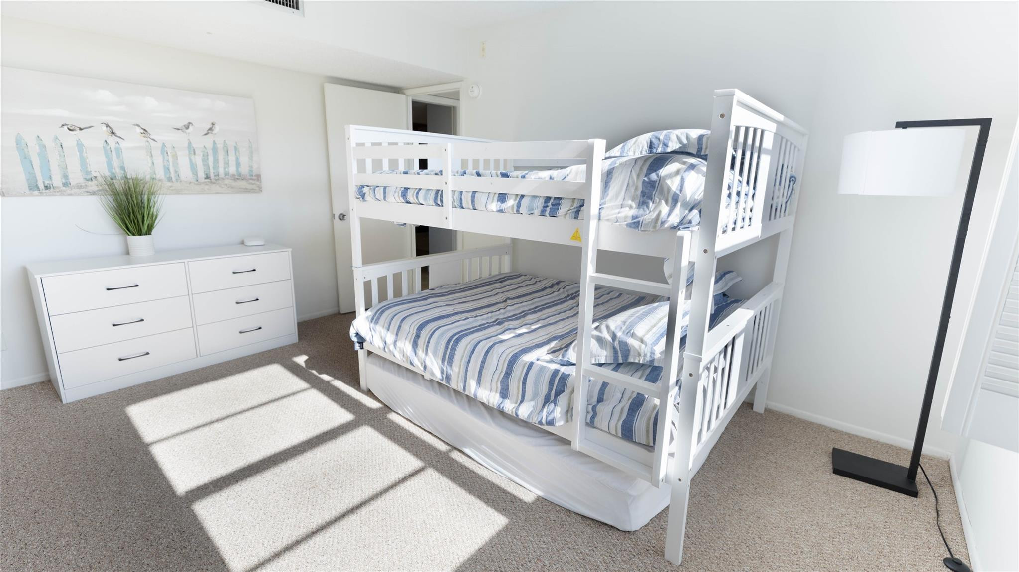 3100 North Course Lane, Unit 510 Pompano Beach, FL 33069 - Photo 14 of 23 a bedroom with a bed a couch and dresser