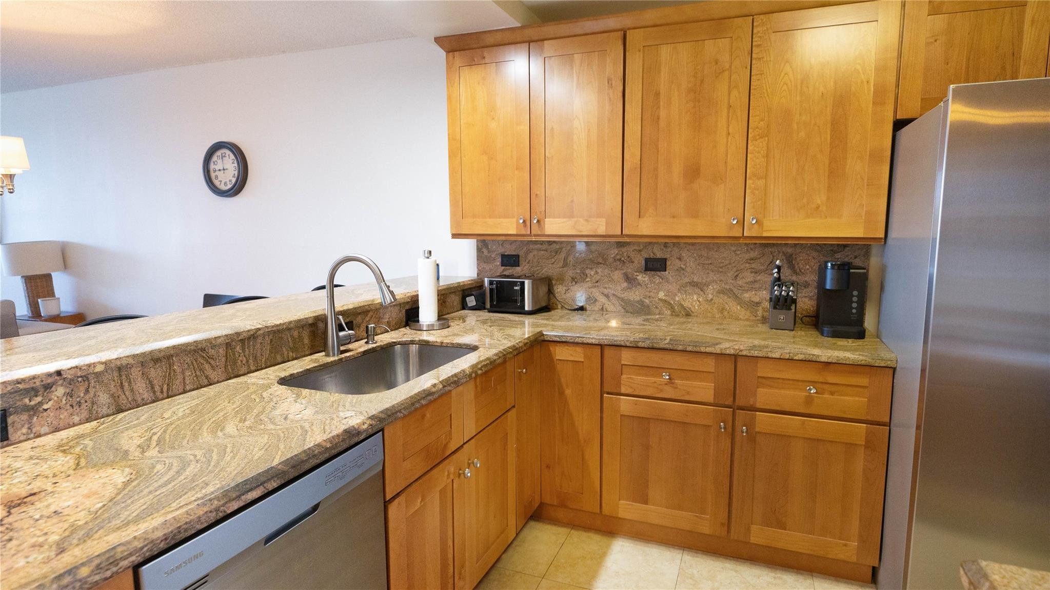 3100 North Course Lane, Unit 510 Pompano Beach, FL 33069 - Photo 10 of 23 a kitchen with granite countertop a sink a window and cabinets