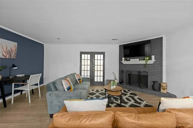 a living room with furniture fireplace and a flat screen tv