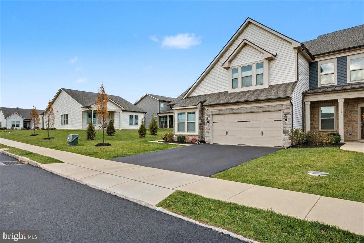 1165 Mason Road Hatfield, PA 19440 - Photo 2 of 33 a front view of a house with a yard and garage
