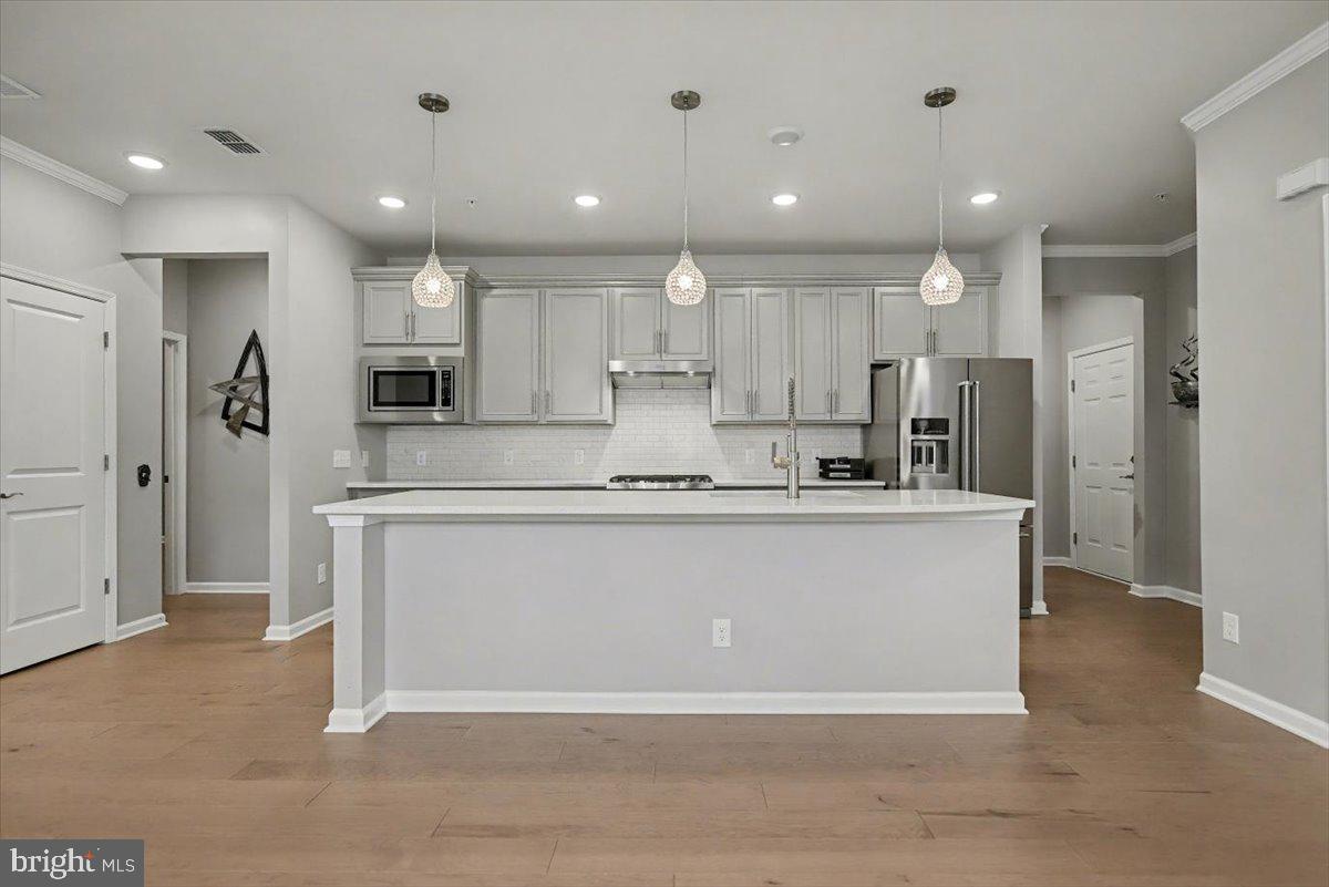 1165 Mason Road Hatfield, PA 19440 - Photo 8 of 33 a large kitchen with stainless steel appliances granite countertop a stove a refrigerator a sink and a oven