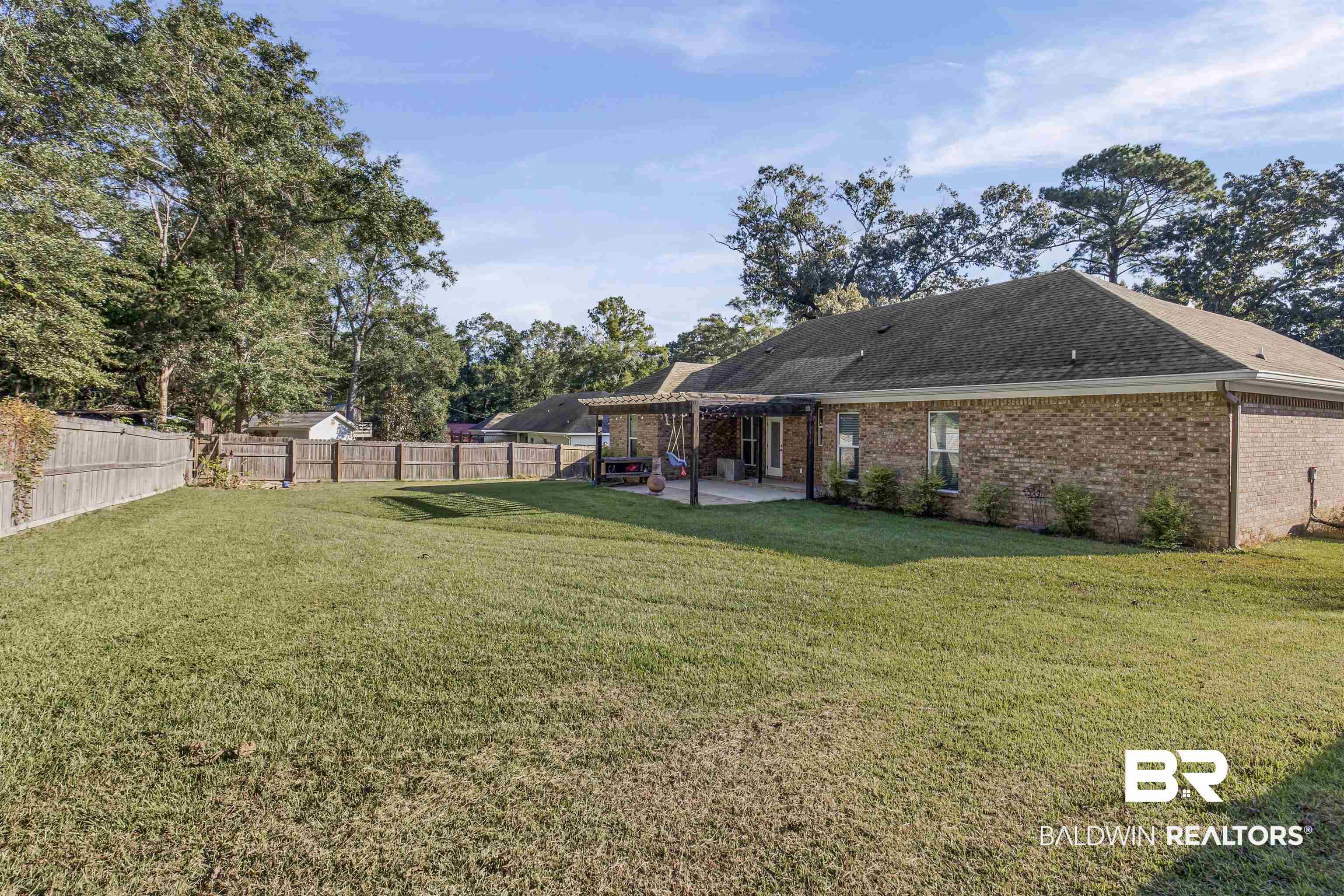 30851 Joseph Drive Spanish Fort, AL 36527 - Photo 21 of 22 Rear view of property with a patio area, brick siding, a fenced backyard, a pergola, and a shingled roof