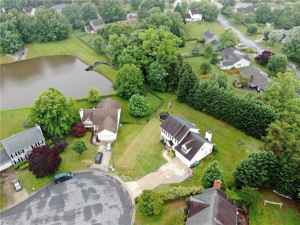 4129 Carroll Ridge Court High Point, NC 27265 - Photo 2 of 30 Drone view shows pond that is accessible to all neighborhood! Nice spacing between homes. Backyard is private w/evergreen buffer.