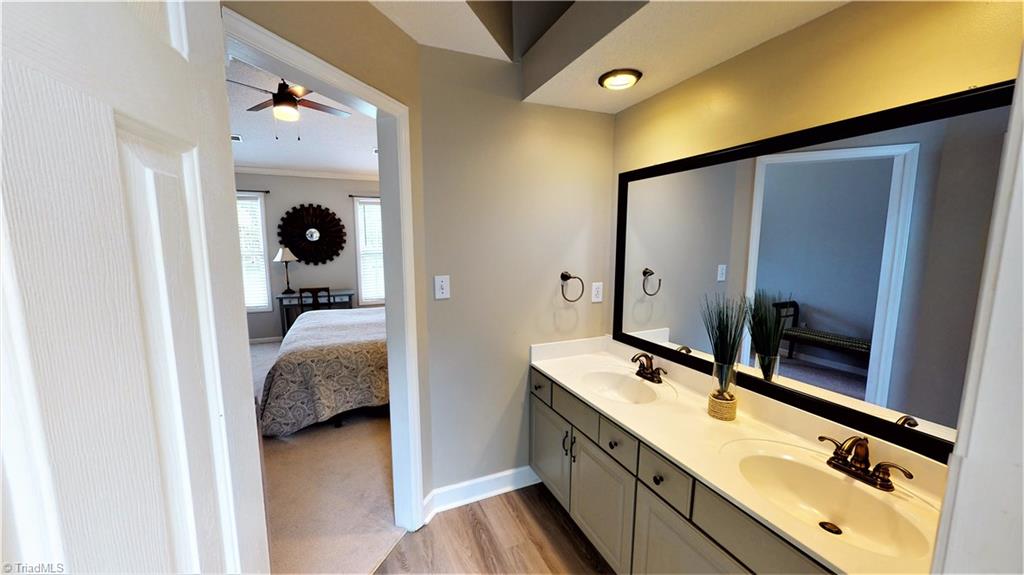 4129 Carroll Ridge Court High Point, NC 27265 - Photo 21 of 30 Vanity area has its own room, making day prep much easier! Large linen closet and plenty of under sink storage.