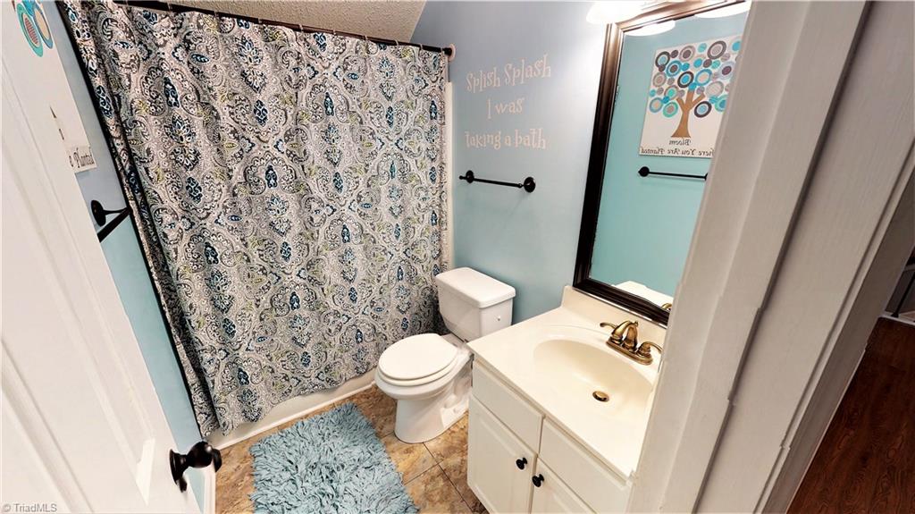 4129 Carroll Ridge Court High Point, NC 27265 - Photo 25 of 30 Attractive guest bath...updated hardware plus a framed mirror...