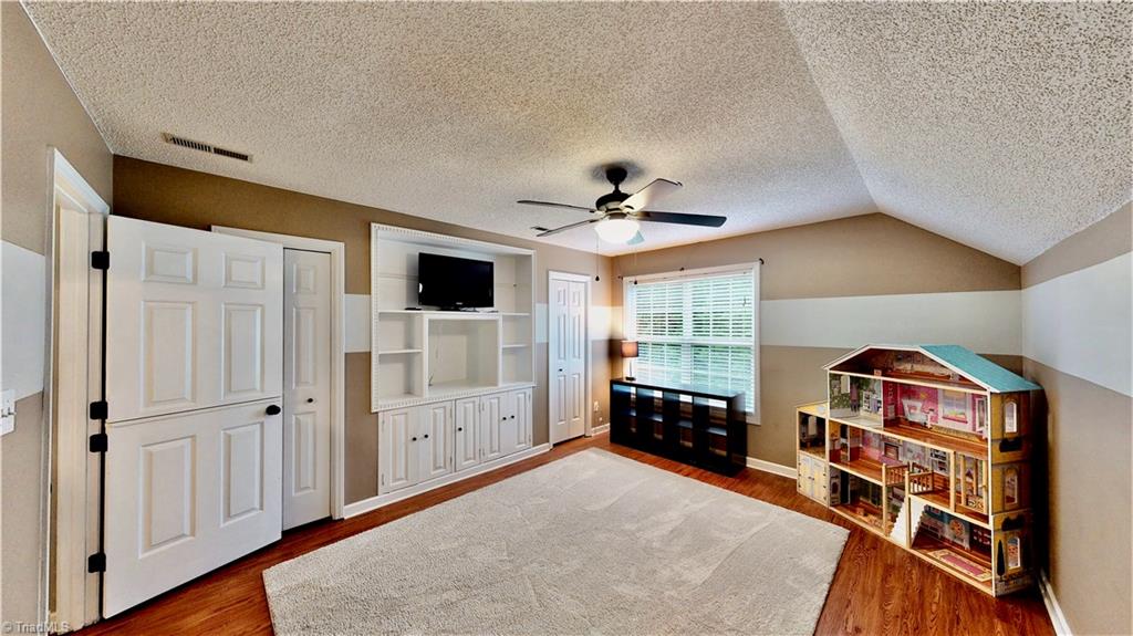 4129 Carroll Ridge Court High Point, NC 27265 - Photo 26 of 30 Large 4th bedroom/bonus has Dutch door, two closets, and built-ins w/laminate flooring.