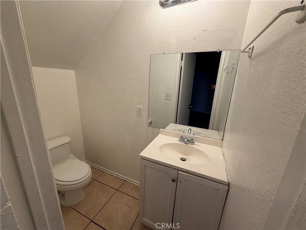 9240 Date Street, Unit 9F Fontana, CA 92335 - Photo 6 of 13 a bathroom with a sink toilet and shower