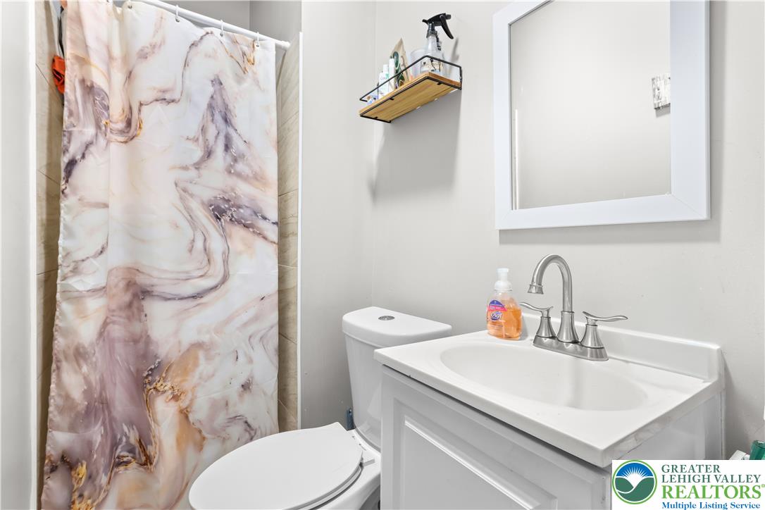 12 South Front Street Coplay, PA 18037 - Photo 17 of 41 This bathroom provides essential comfort and functionality, perfect for everyday living.
