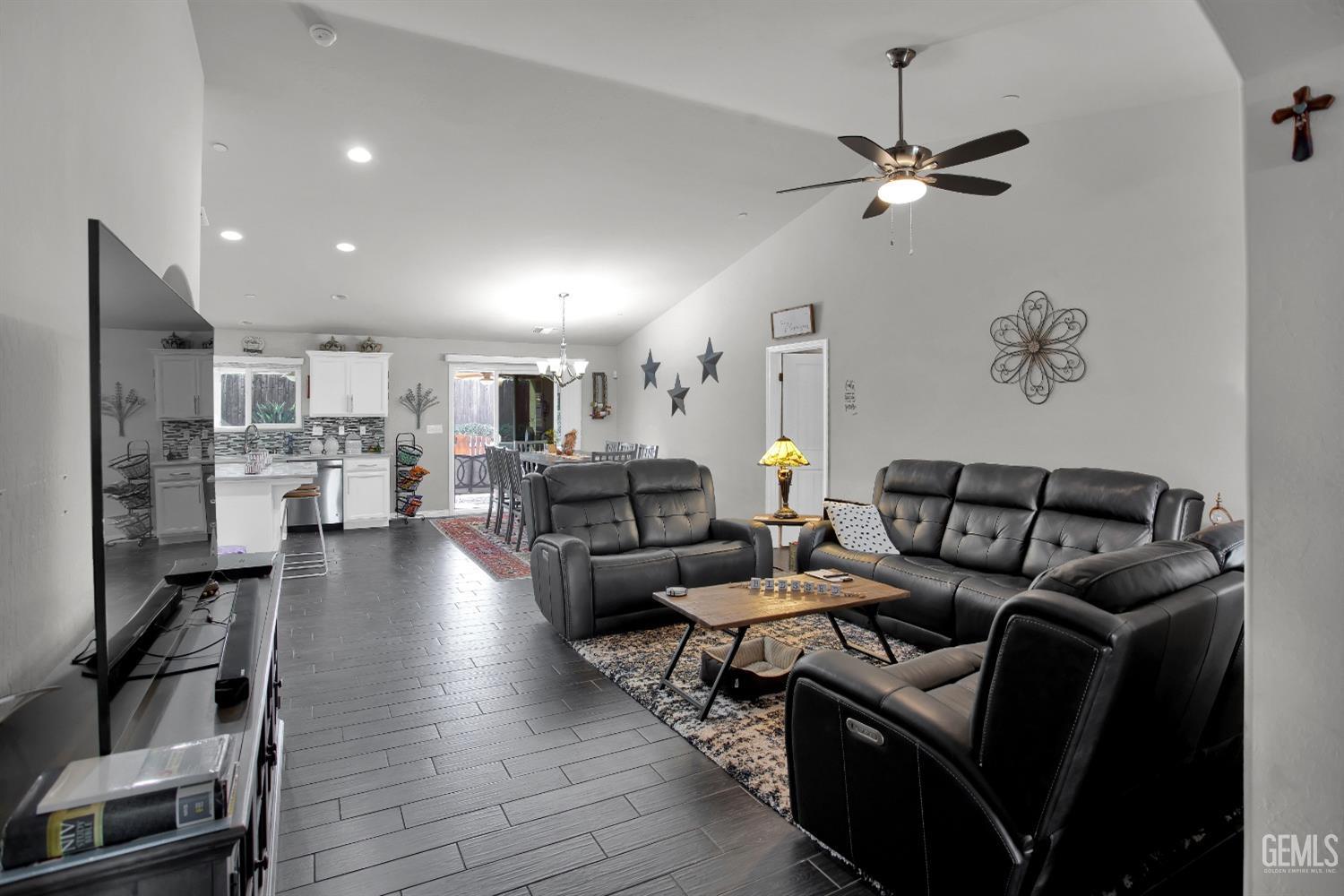 Undisclosed Address Bakersfield, CA 93311 - Photo 11 of 22 a living room with furniture and a view of kitchen
