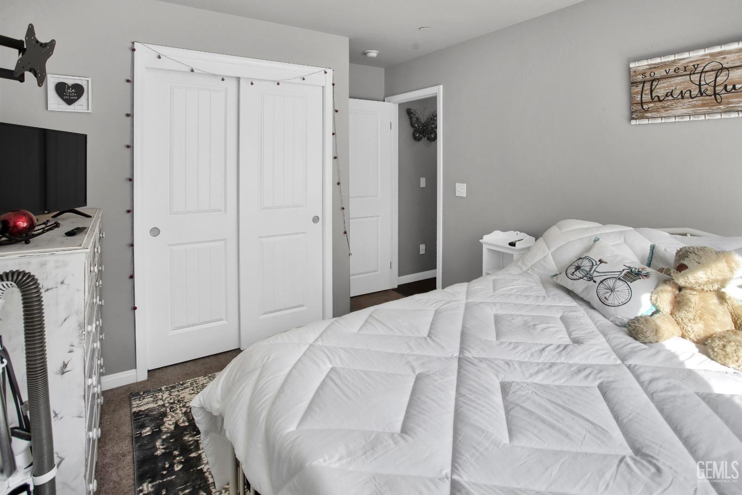 Undisclosed Address Bakersfield, CA 93311 - Photo 15 of 22 a bedroom with a bed and a tv