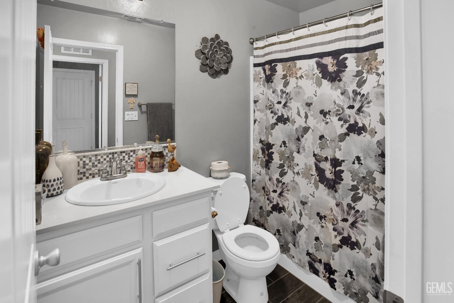 Undisclosed Address Bakersfield, CA 93311 - Photo 16 of 22 a bathroom with a sink toilet and shower