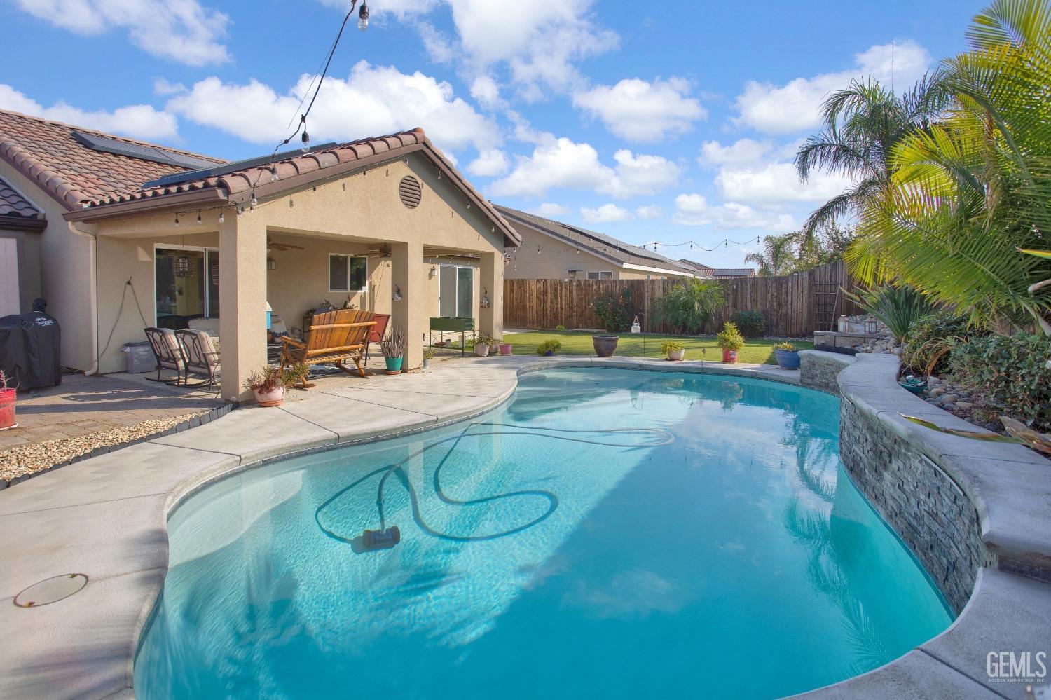 Undisclosed Address Bakersfield, CA 93311 - Photo 20 of 22 a view of a house with swimming pool and sitting area