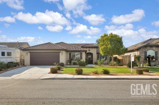 Undisclosed Address Bakersfield, CA 93311 - Photo 2 of 22 a front view of a house with a yard