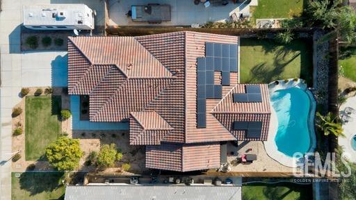 Undisclosed Address Bakersfield, CA 93311 - Photo 4 of 22 a front view of a house with a garden
