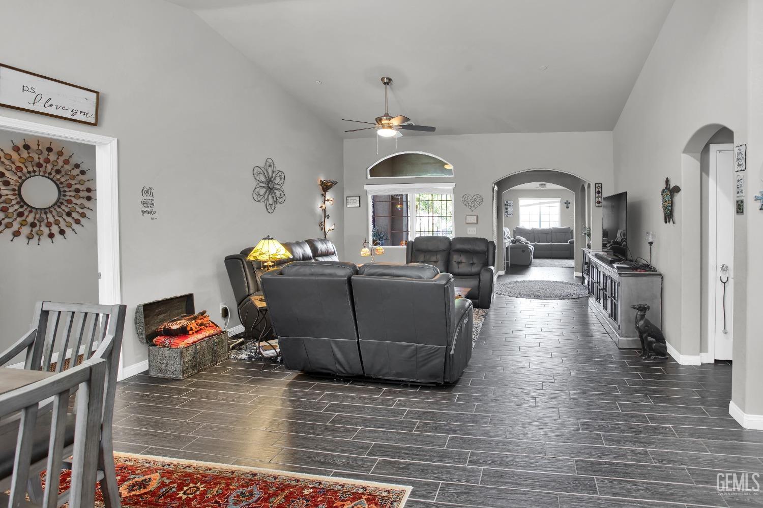 Undisclosed Address Bakersfield, CA 93311 - Photo 9 of 22 a living room with furniture and a chandelier