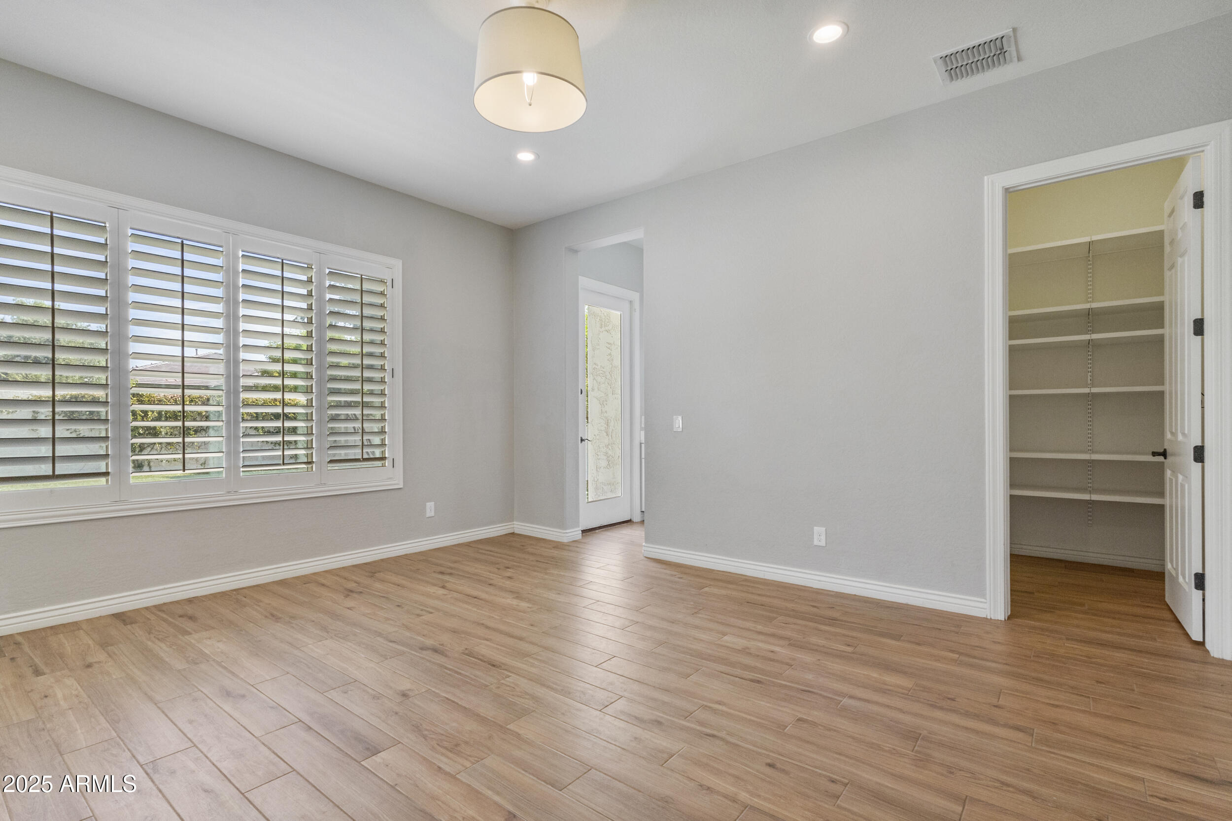 4292 East Morrison Ranch Parkway Gilbert, AZ 85296 - Photo 20 of 55 wooden floor in an empty room with a window