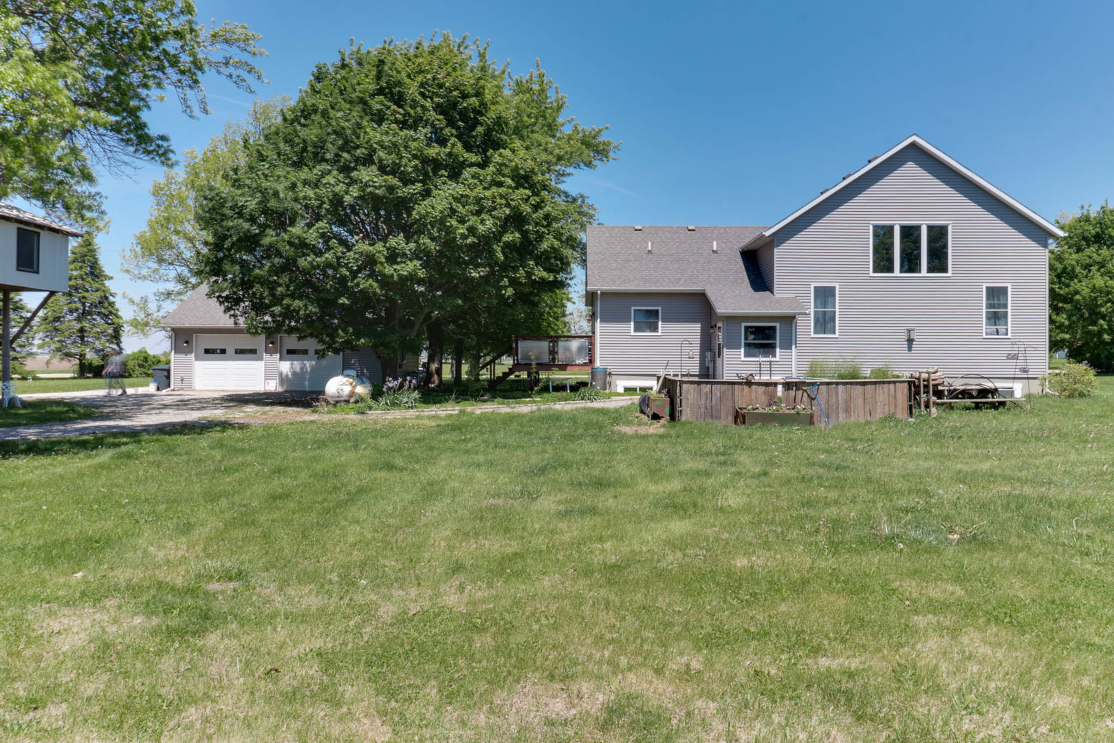12014 Prairie Center Road Clinton, IL 61727 - Photo 44 of 56 a view of house with a yard
