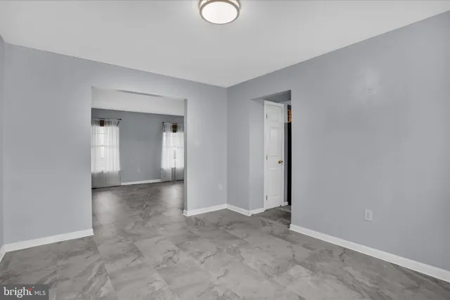 a kitchen with stainless steel appliances granite countertop a sink a stove and refrigerator