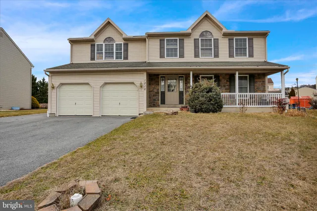 a front view of a house with yard