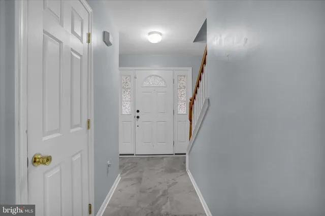 a view of a hallway with a door