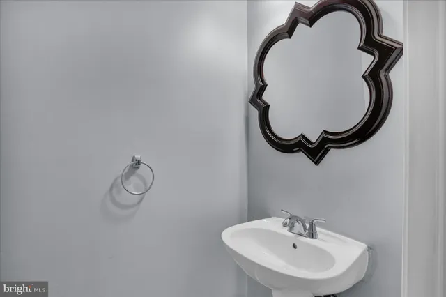 a bathroom with a sink and mirror