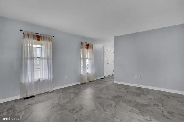 an empty room with windows