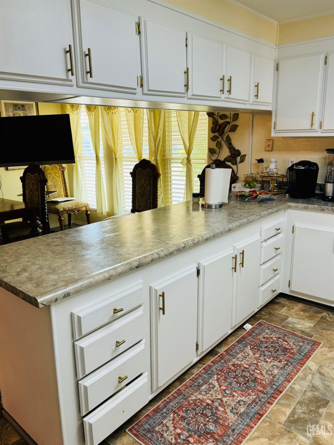 Undisclosed Address Bakersfield, CA 93313 - Photo 15 of 32 a kitchen with stainless steel appliances granite countertop a sink and cabinets