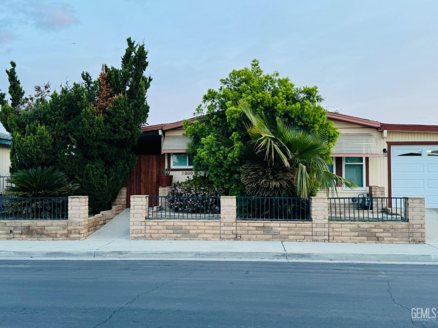 Undisclosed Address Bakersfield, CA 93313 - Photo 2 of 32 a view of a house with a street