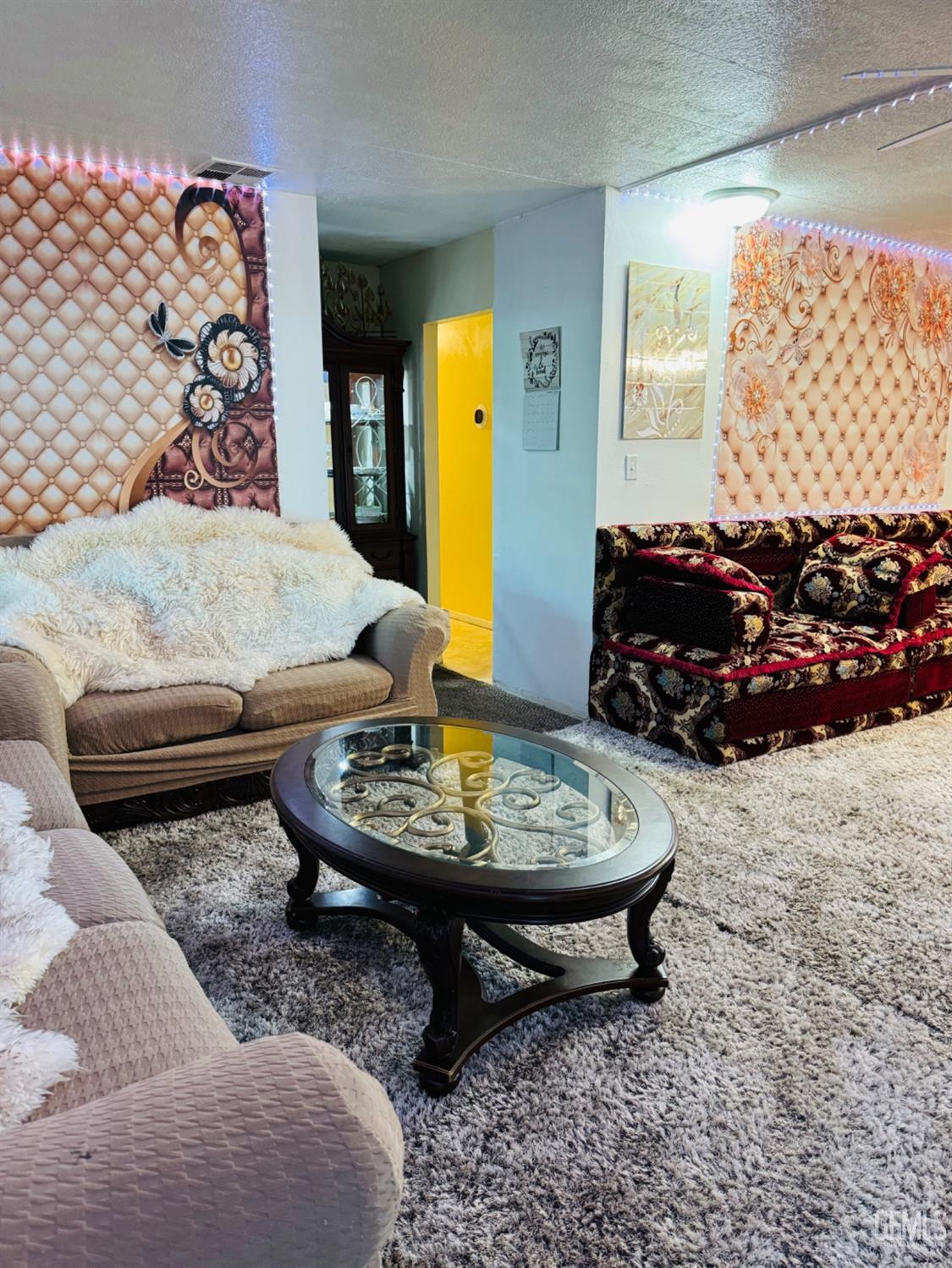 Undisclosed Address Bakersfield, CA 93313 - Photo 23 of 32 a living room with furniture and a fireplace