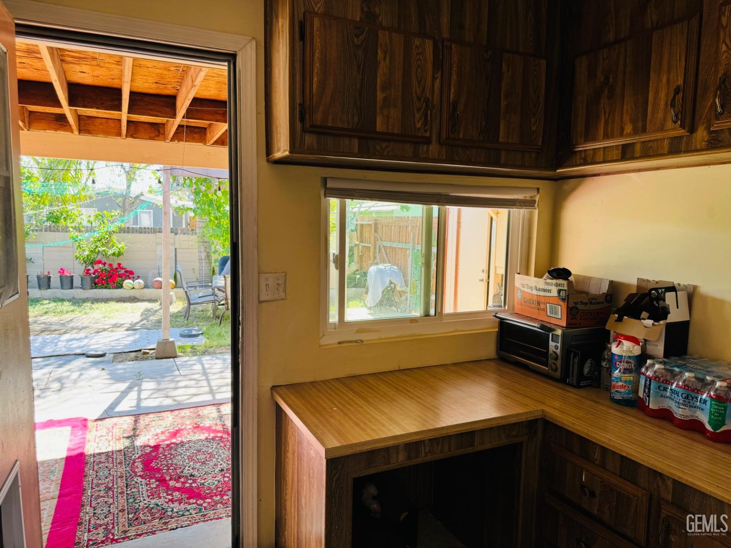 Undisclosed Address Bakersfield, CA 93313 - Photo 28 of 32 a kitchen with stainless steel appliances wooden floor and a refrigerator