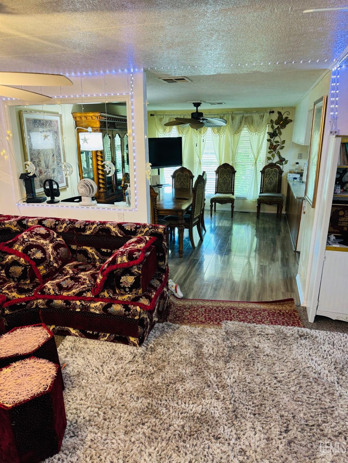 Undisclosed Address Bakersfield, CA 93313 - Photo 6 of 32 a living room with furniture