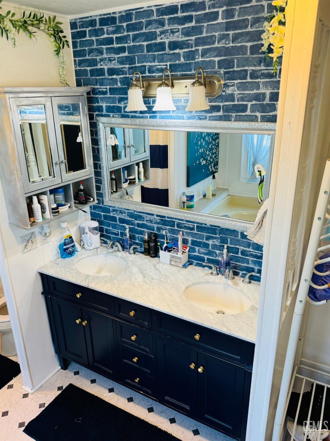 Undisclosed Address Bakersfield, CA 93313 - Photo 7 of 32 a bathroom with a sink vanity granite and a mirror