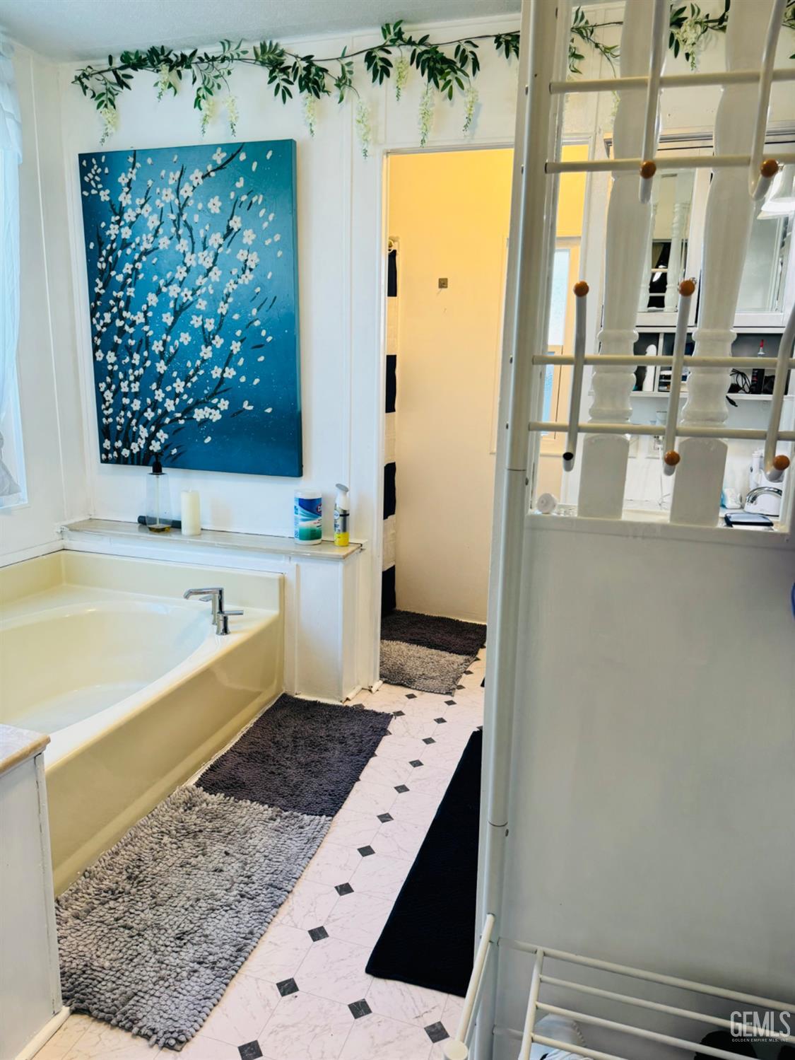 Undisclosed Address Bakersfield, CA 93313 - Photo 8 of 32 a bathroom with a bathtub sink and a shower