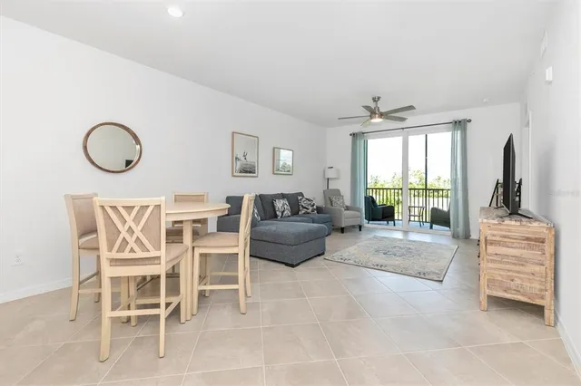 a bedroom with furniture and a floor to ceiling window