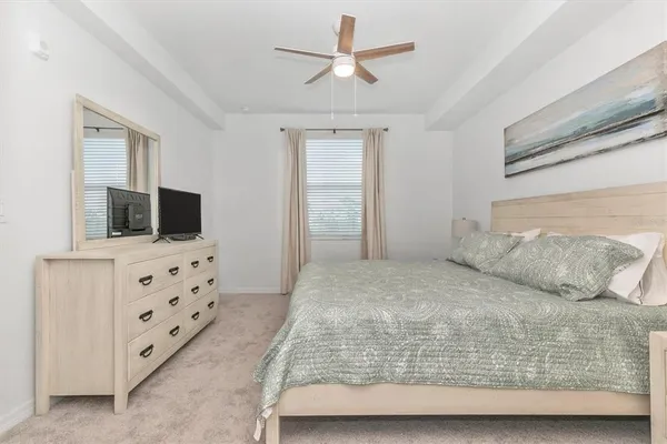 front view of a building with a couple of cars parked in front of a building