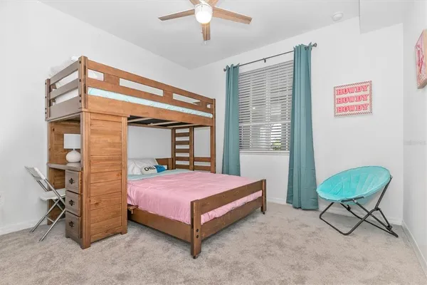 a building outdoor space with patio furniture and potted plants