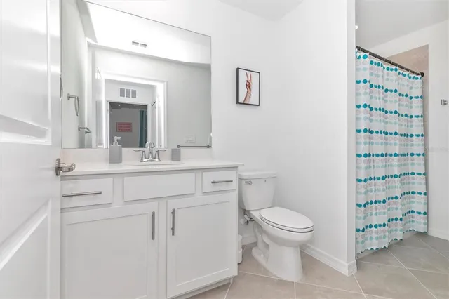 a view of a room with gym equipment and a large window