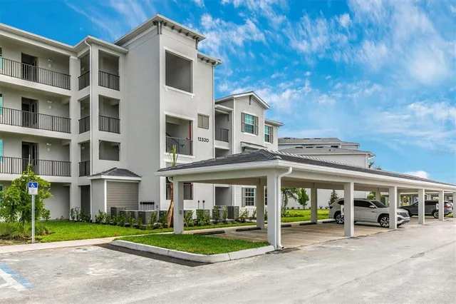 a building with car parked in front of it