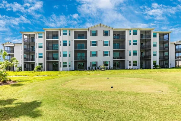 a dining room with lots of wooden furniture and a chandelier