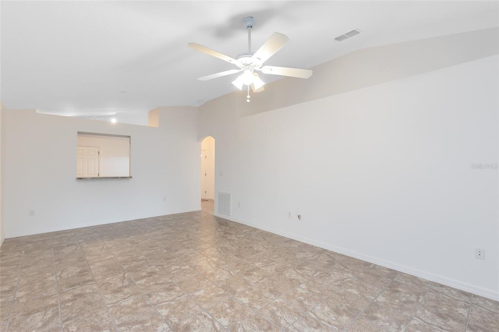 2717 Shelby Ruth Place St. Cloud, FL 34769 - Photo 11 of 31 an empty room with a window and ceiling fan