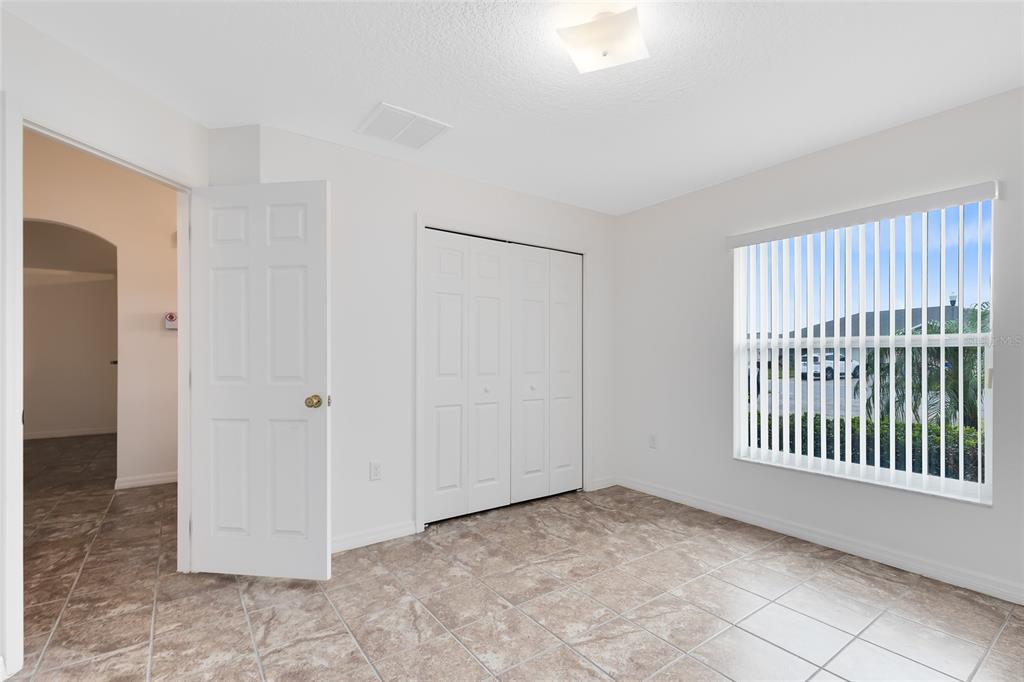 2717 Shelby Ruth Place St. Cloud, FL 34769 - Photo 14 of 31 a view of an empty room with a window