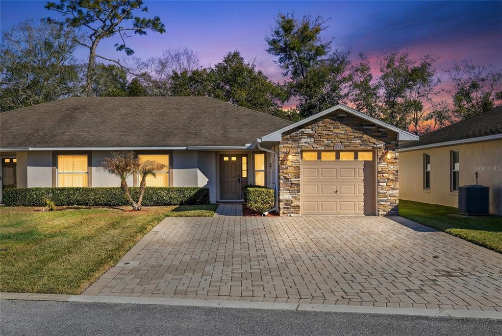 2717 Shelby Ruth Place St. Cloud, FL 34769 - Photo 2 of 31 a view of a house with a yard