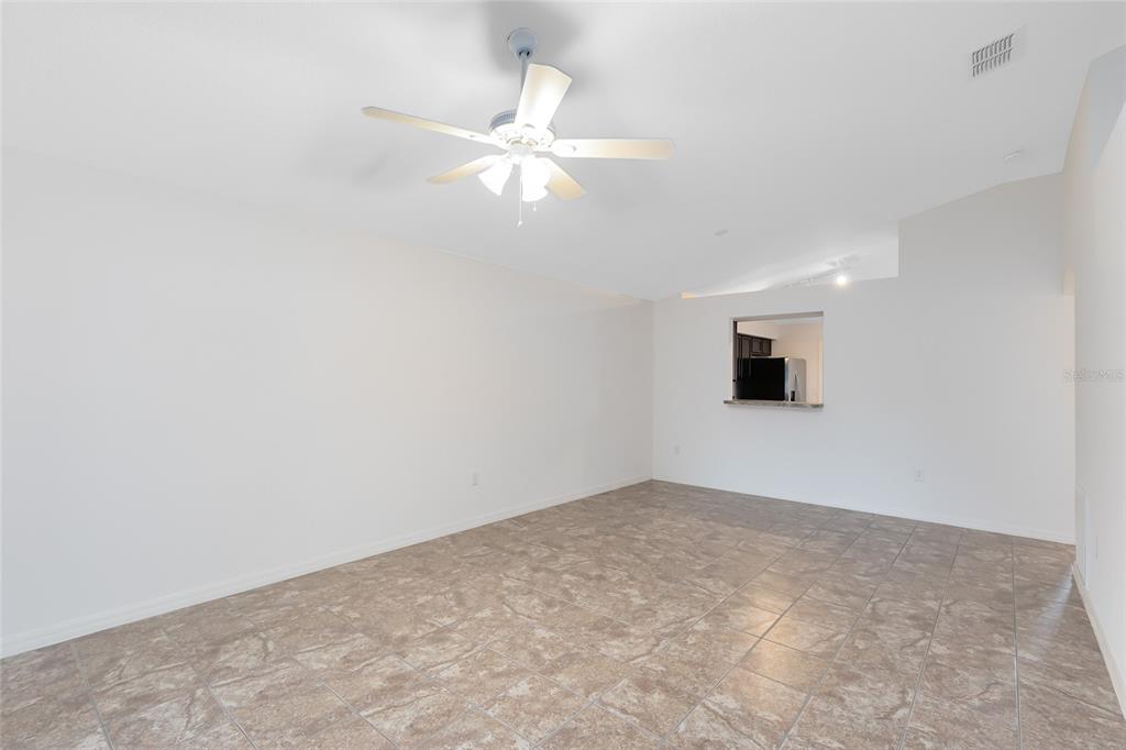 2717 Shelby Ruth Place St. Cloud, FL 34769 - Photo 10 of 31 wooden floor in an empty room